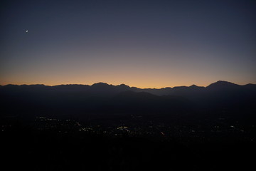 Naklejka premium view of mountain silhouette on twilight sky after sunset, Japanese alps, Hakuba, Japan