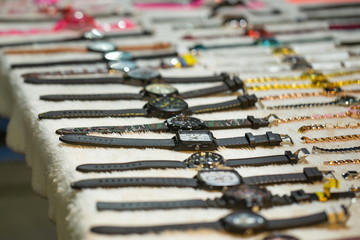 Watch wrist,market,Counterfeit watches Available for sale on the road corridor.