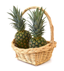 pineapple in basket on white