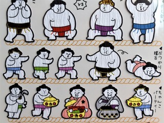 Obraz na płótnie Canvas A sticker showing Japanese rikishi or sumo wrestlers practicing, training, and eating
