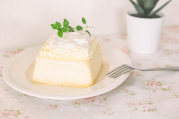 Fresh baked vanilla sponge cake frosting with dairy whipped cream topping with young coconut pudding sauce so sweet and delicious. Exotic asian style dessert. Homemade bakery concept for cafe.