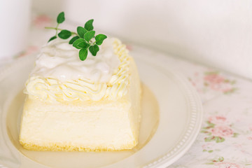 Fresh baked vanilla sponge cake frosting with dairy whipped cream topping with young coconut pudding sauce so sweet and delicious. Exotic asian style dessert. Homemade bakery concept for cafe.