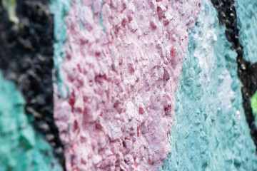mint pink concrete wall in paint as background closeup