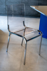 A designed transparent chairs on the show room. High quality photo