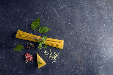 Fresh ingredients for cocking pasta with Traditiona Italian sauce Pesto. Dry Spaghetti, Basil...