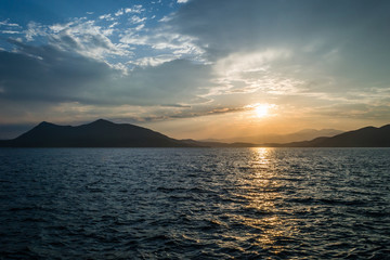 Naklejka na ściany i meble Sunset over the island of Evia 