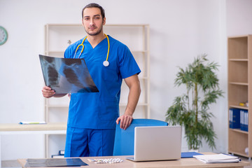 Young male doctor radiologist working in the clinic