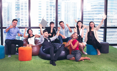 Fototapeta premium Group of business people sitting and working or relaxing in workplace office or co-working space