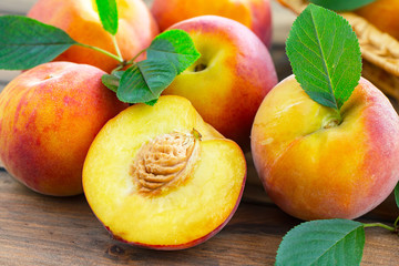 Ripe peaches on an old background
