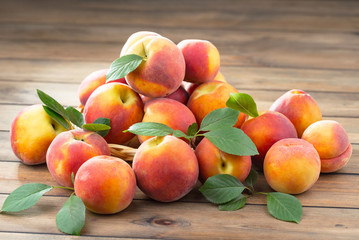 Fototapeta na wymiar Ripe peaches on an old background