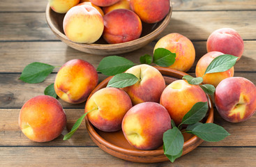 Ripe peaches on an old background