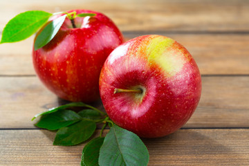 Red apples on old background