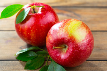 Red apples on old background