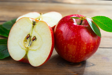 Red apples on old background