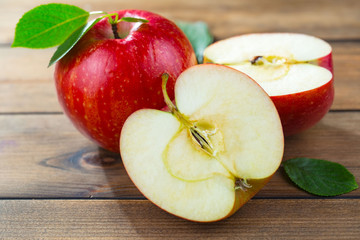 Red apples on old background