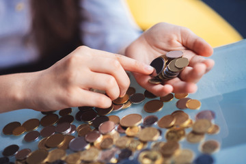 Fototapeta premium Close up picture of girls hands counting coins