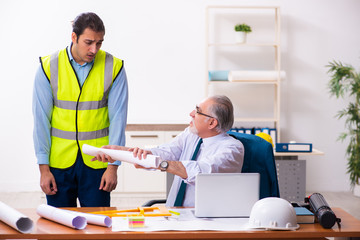 Two male architects working in the office