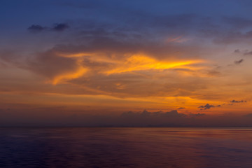Color cloud on Sunset sky with in golden time at the lake.
