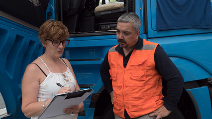 Woman giving instructions to man.