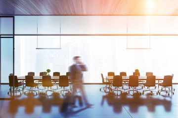 Businessman in panoramic meeting room