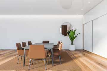 White dining room interior with mirror