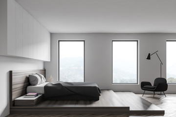 Naklejka na ściany i meble White bedroom with armchair and window