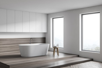Obraz na płótnie Canvas White and wooden bathroom corner with tub