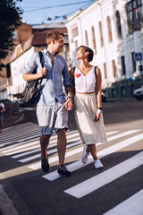 Obraz premium Man and woman having a rest in city at sunny day