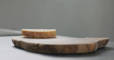 ciabatta slice on olive board