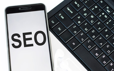 the word SEO, search engine optimization on the phone screen