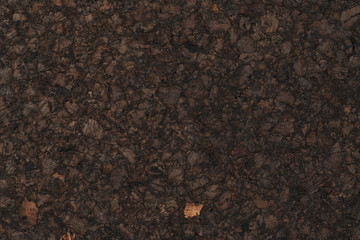 Texture of dark cork with oil finish
