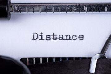 Distance on white sheet in vintage typewriter