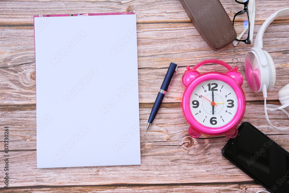 Poster notebook and smartphone on wood table and space for text