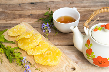 herbal healthy drinks hot tea with pineapple drying dessert snack tasty of lifestyle relax arrangement flat lay style on background wooden 