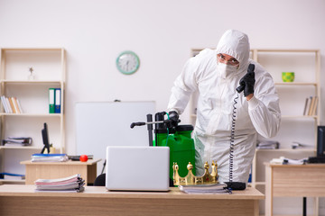 Contractor disinfecting office for COVID-19 coronavirus