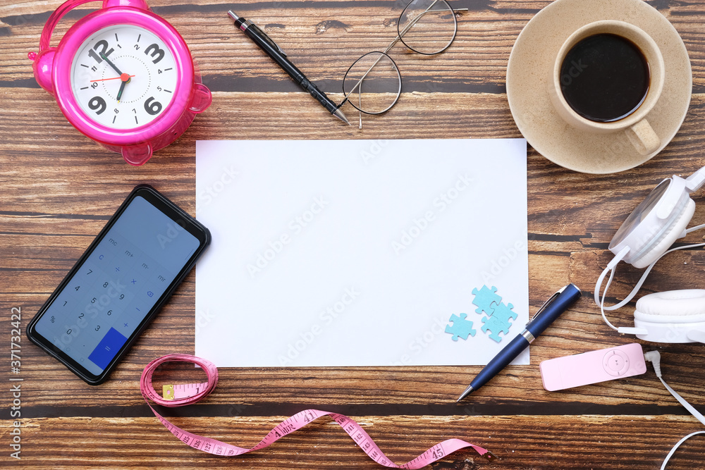 Poster Notebook and smartphone on wood table and space for text