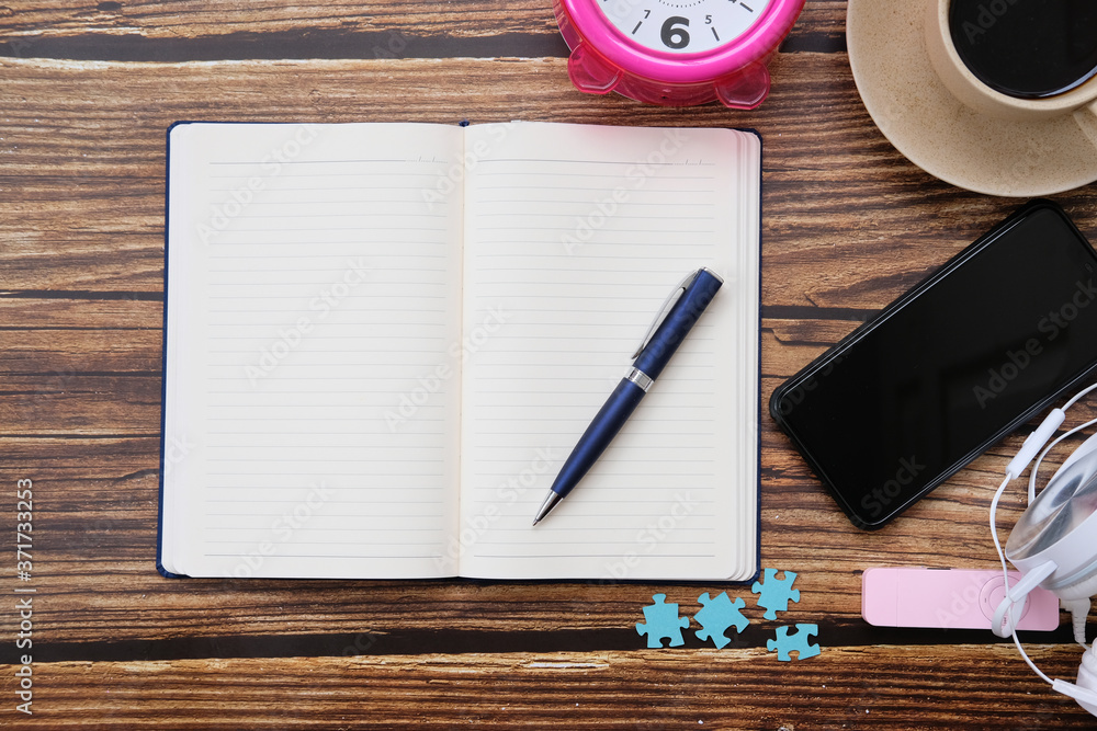 Poster notebook and pen on the table