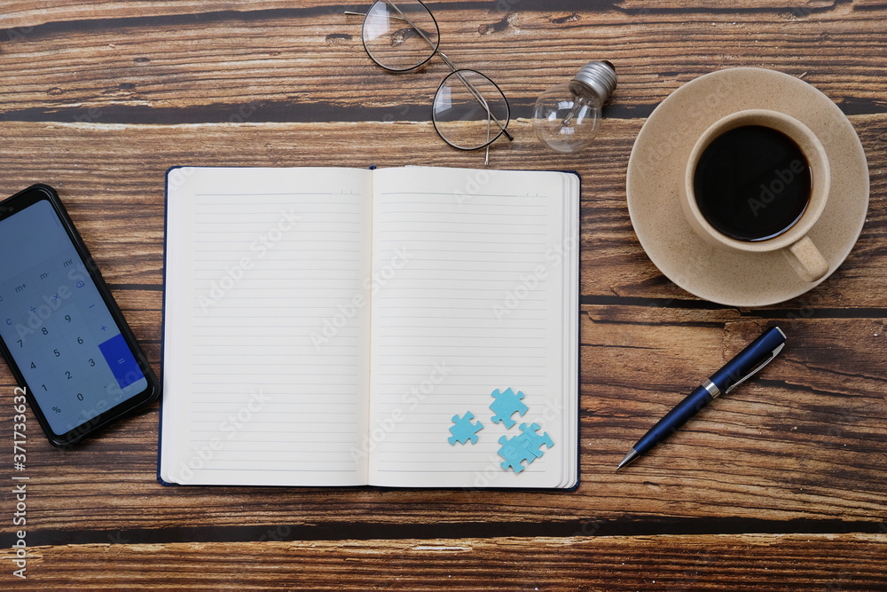 Poster notebook and smartphone on wood table and space for text