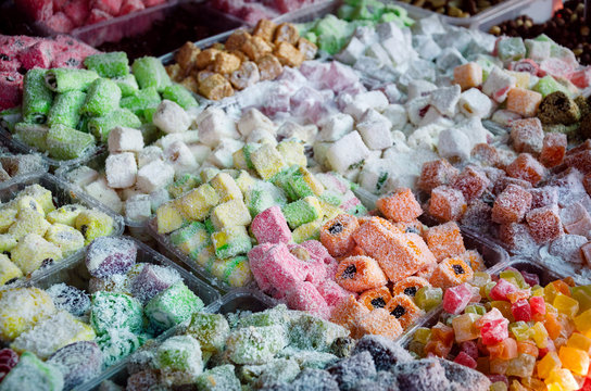 Eastern sweet Turkish delight in coconut flakes on market