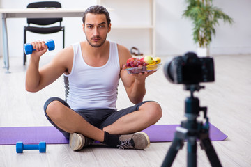 Fototapeta na wymiar Young male blogger in dieting concept
