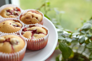 Healthy dessert - strawberry muffins on white plate