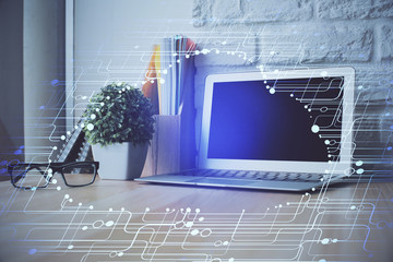 Double exposure of desktop computer and technology theme hologram. Concept of software development.