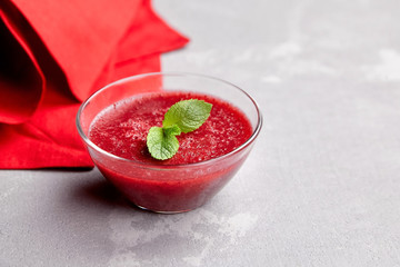 Sweet strawberry mousse with mint leaves, delicious summer dessert