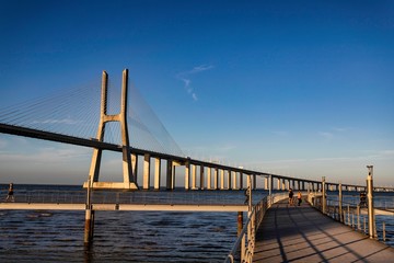 The Vasco da Gama Bridge is a cable-stayed bridge flanked by viaducts and spans the Tagus River in Parque das Nações in Lisbon, the capital of Portugal. It is the longest bridge in the European Union