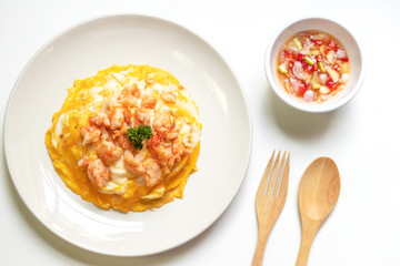 Creamy omelette with shrimps on rice served fish sauce with Thai chilis (Thai condiment “Prik Nam Pla”). Delicious and easy menu.  