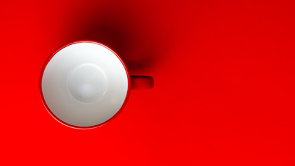 red mug on red background