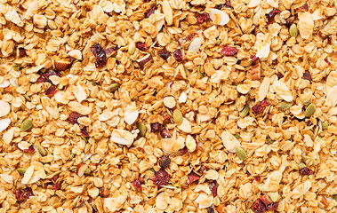 Organic homemade roasted granola with nuts and fruits. Food for breakfast. Granola texture.