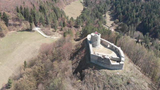 Flying backward from castle in village Rytro in spring