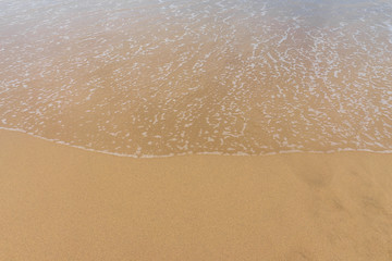 Fototapeta na wymiar Breeze in the sand. Background.