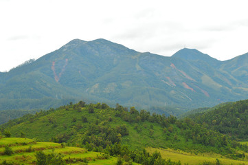 Obraz premium distant mountains with landslides during rains